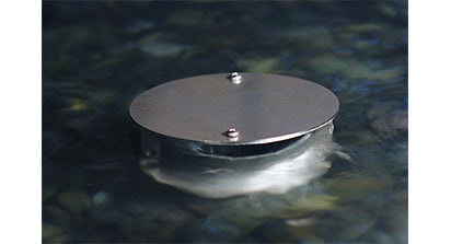 Filtrific Surface Flow Cap operating in a formal concrete water feature